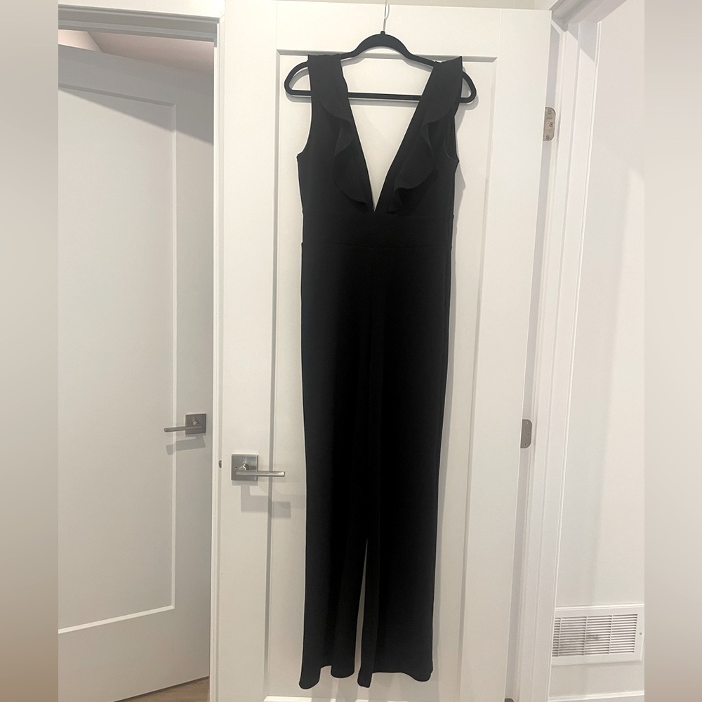 Plunge Jumpsuit with ruffle shoulders